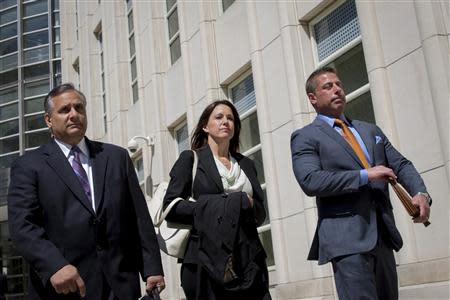 Diana Durand, ex-girlfriend and former fundraiser for Republican U.S. Representative Michael Grimm exits the Brooklyn Federal Courthouse with her lawyers in the Brooklyn Borough of New York May 5, 2014. REUTERS/Brendan McDermid