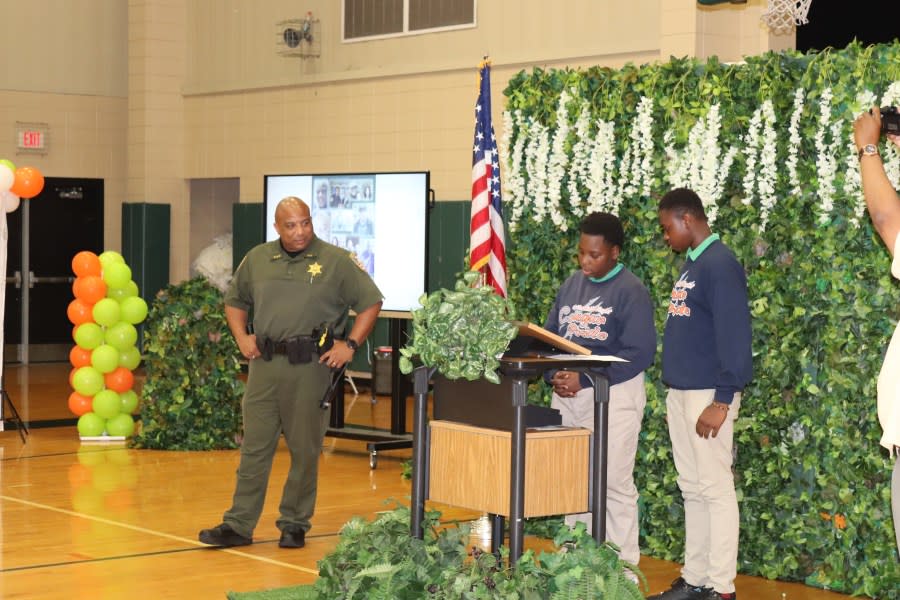 Lt. James Jamison accepting award during Capitol Middle School ceremony (Photo Courtesy of East Baton Rouge School System)