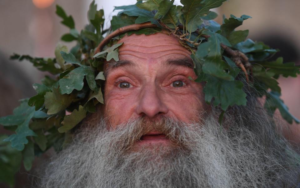 Druids perform a ceremony during summer solstice celebrations at the ancient Stonehenge monument - NEIL HALL/EPA-EFE/Shutterstock