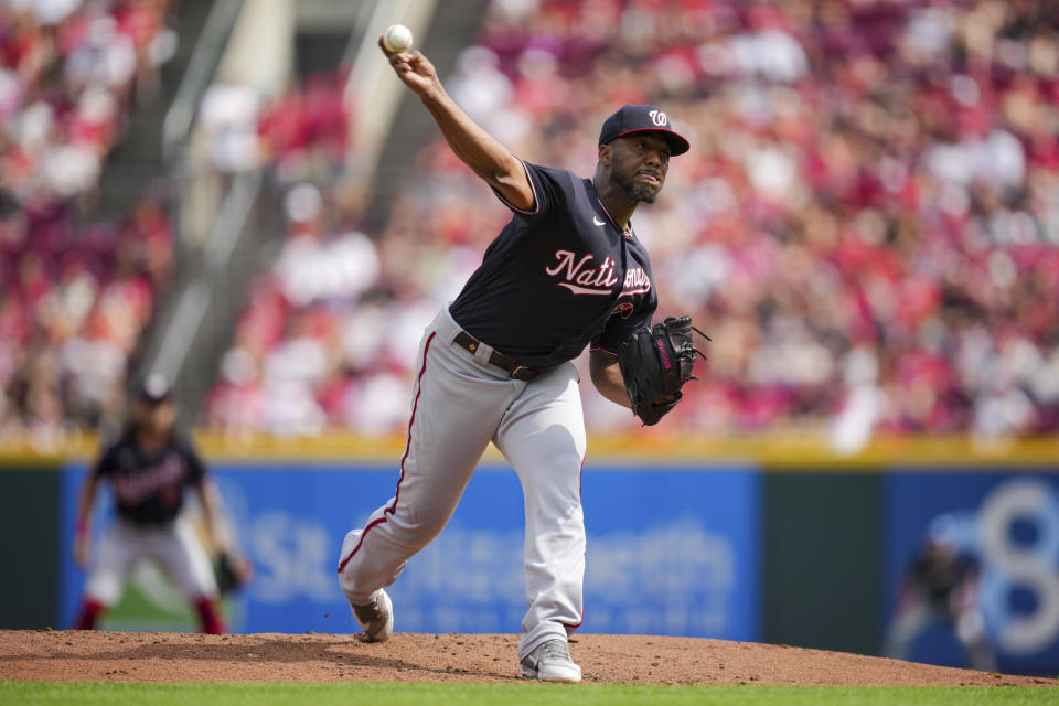 Washington Nationals' Joan Adon throws during the first inning of a baseball game against the Cincinnati Reds in Cincinnati, Saturday, Aug. 5, 2022. (AP Photo/Aaron Doster)