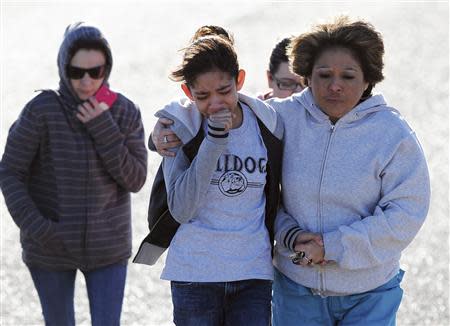 Students are reunited with families following an early morning shooting at Berrendo Middle School in Roswell, New Mexico, January 14, 2014. REUTERS/Mark Wilson/Roswell Daily Record