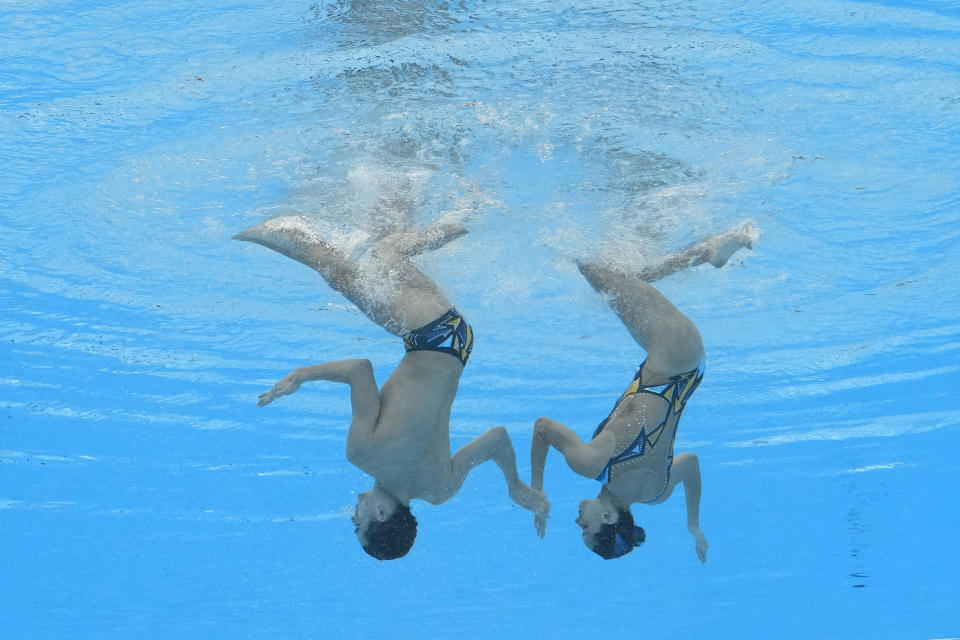 Dennis Gonzalez Boneu and Mireia Hernandez Luna, of Spain, compete in the mixed duet free final of artistic swimming at the World Aquatics Championships in Doha, Qatar, Saturday, Feb. 10, 2024. (AP Photo/Lee Jin-man)