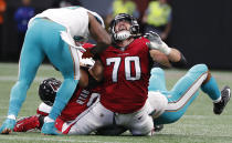<p>Atlanta Falcons offensive tackle Jake Matthews (70) reacts to players on his legs as Matt Ryan is sacked against the Miami Dolphins during the second half of an NFL football game, Sunday, Oct. 15, 2017, in Atlanta. (AP Photo/David Goldman) </p>