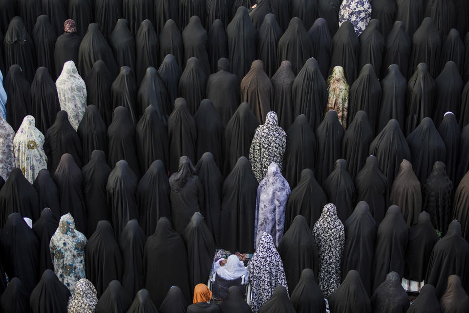 Shiite women attend Eid al-Fitr prayer at Imam Ali shrine in Najaf, Iraq, Saturday, April 22, 2023. Eid al-Fitr holiday marks the end of the holy Islamic month of Ramadan. (AP Photo/Anmar Khalil)