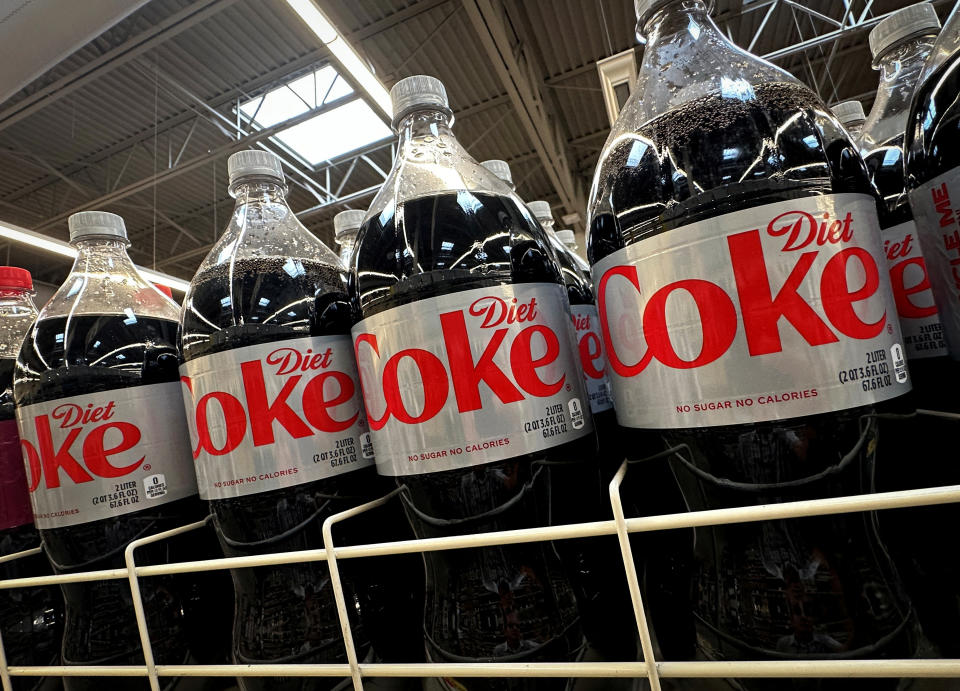 Diet Coke bottles on display in store.