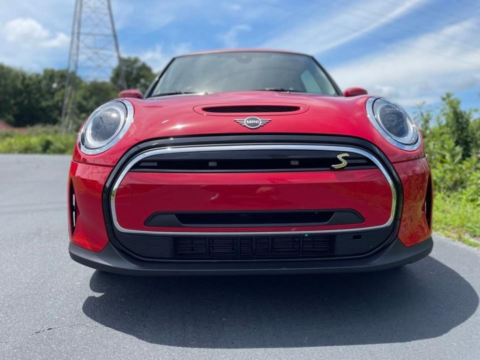 The front of a 2023 red Mini Cooper SE.