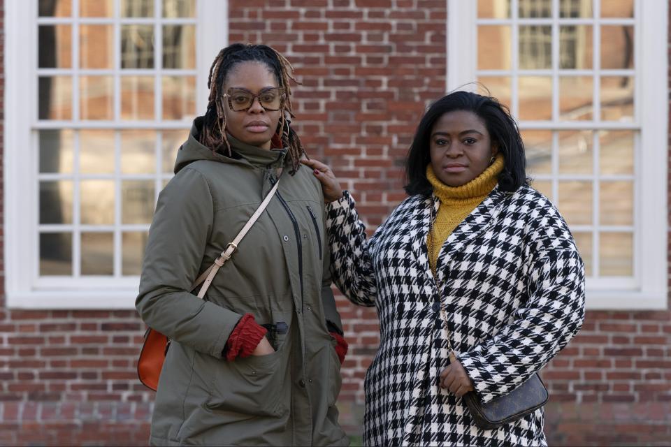 Charity Wallace, left, and Chassity Coston pose in Harvard Yard at Harvard University, Saturday, Feb. 24, 2024, in Cambridge, Mass. With attacks on diversity, equity and inclusion initiatives raging on, Black women looking to climb the work ladder are seeing a landscape that looks more hostile than ever. (AP Photo/Michael Dwyer)