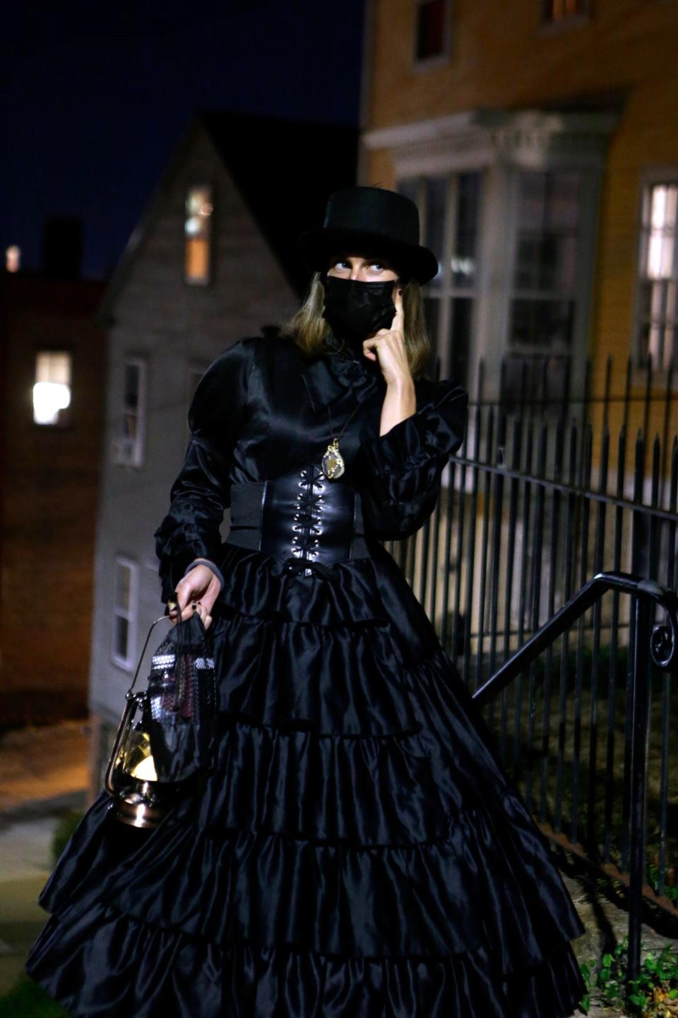 Providence Ghost Tour guide Charlene Pratt stands on Meeting Street at Congdon, pointing out sites of ghostly interest on the East Side.