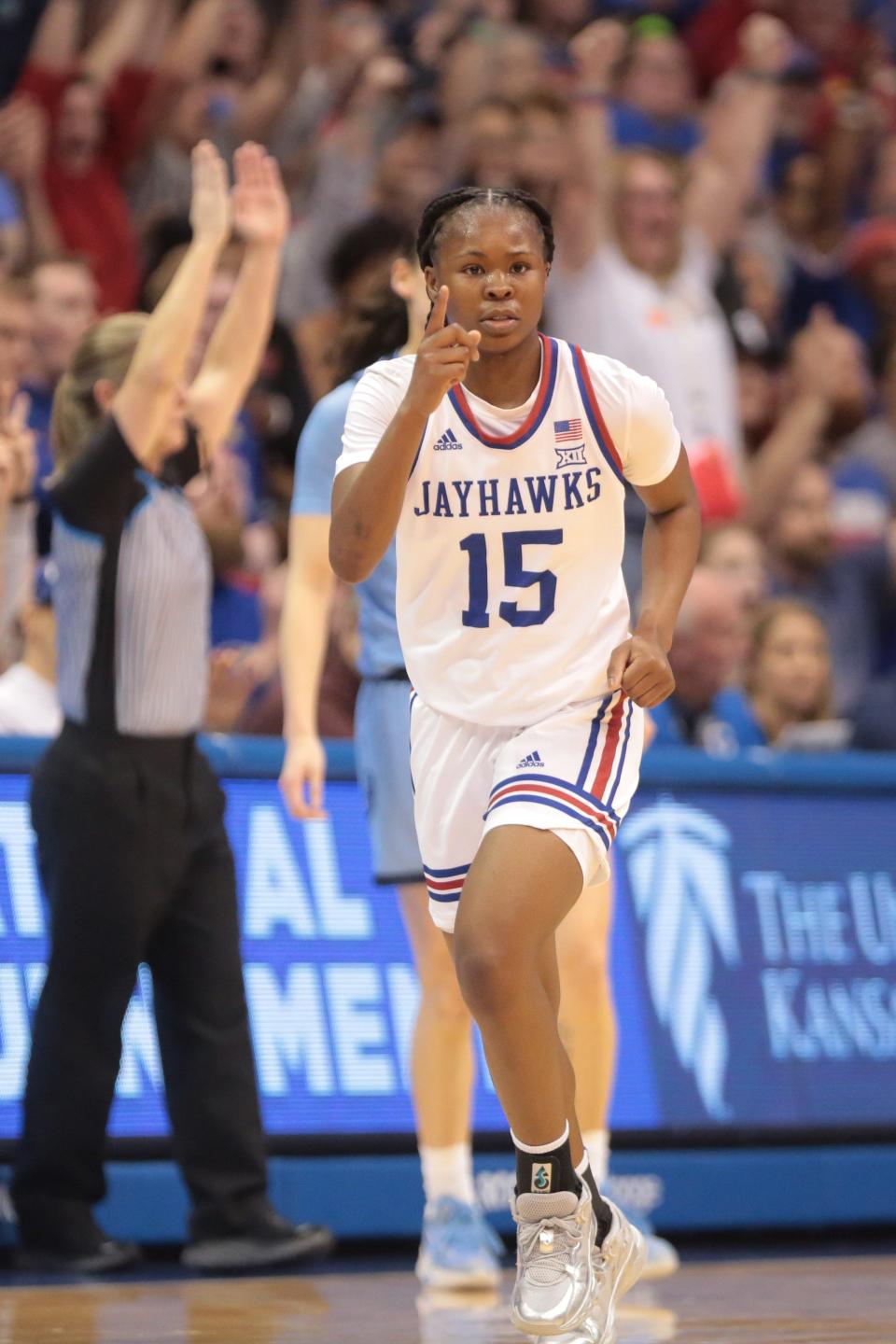 Kansas guard Zakiyah Franklin (15) reacts after hitting a shot against Columbia during the Jayhawks' WNIT championship game victory this past season inside Allen Fieldhouse.