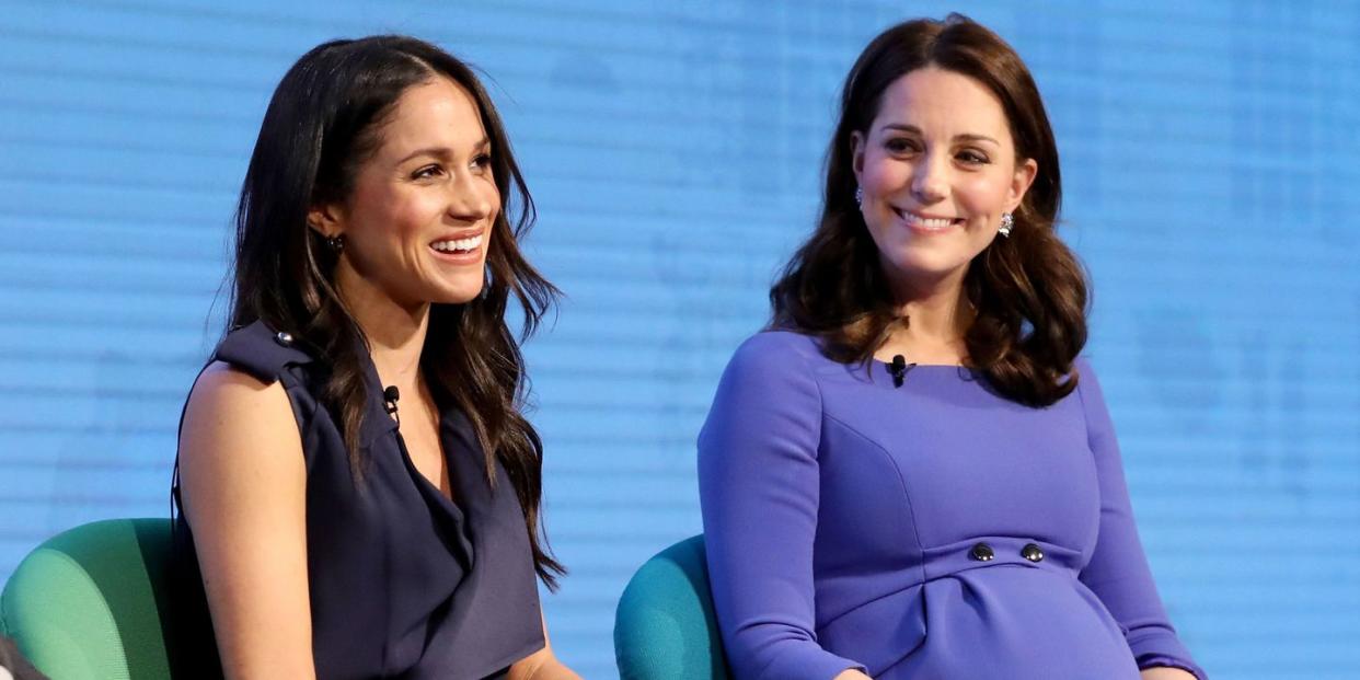 meghan markle and kate middleton sitting side by side at event