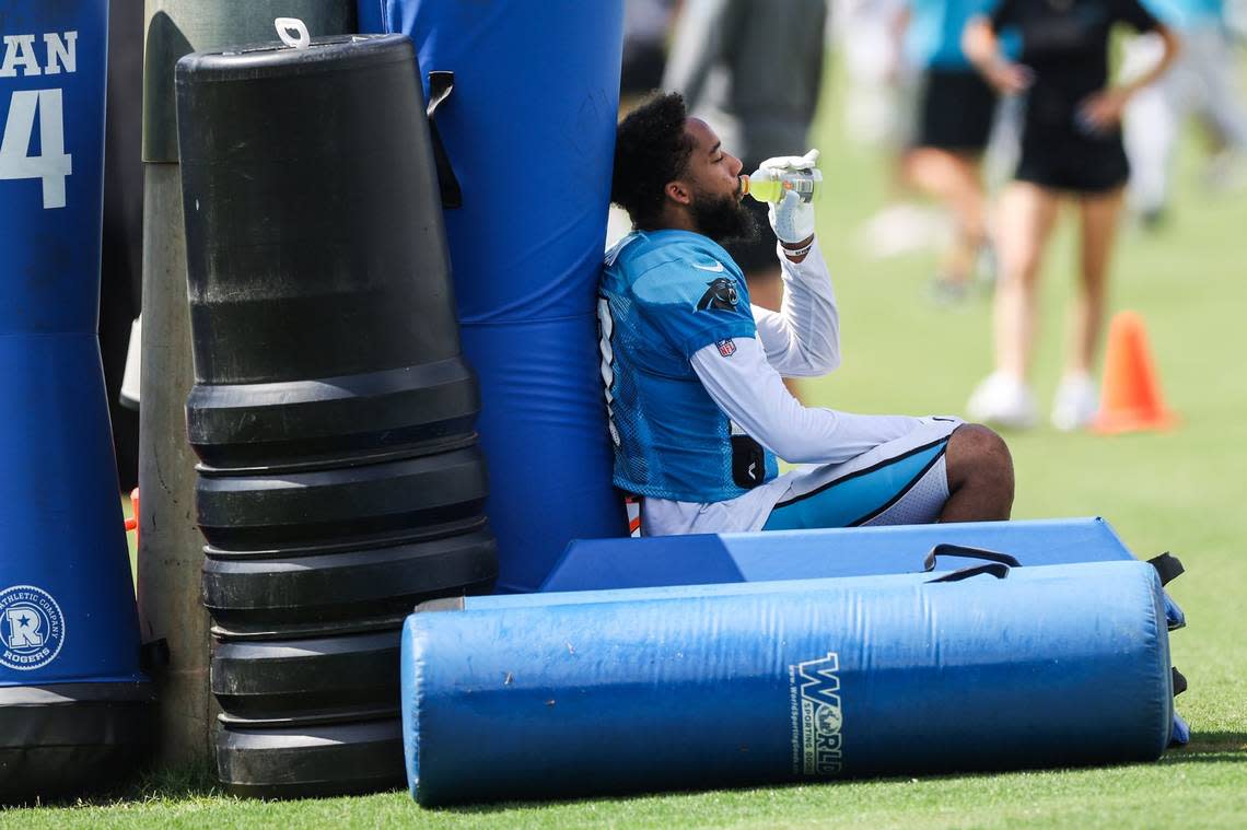 Panthers safety Kenny Robinson hydrates during a break between practices at training camp on Tuesday, August 9, 2022 in Spartanburg, SC.