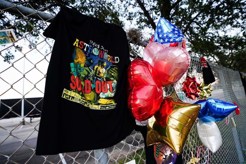 A t-shirt and balloons are placed at a memorial outside of the canceled Astroworld festival at NRG Park on November 7, 2021 in Houston, Texas. According to authorities, eight people died and 17 people were transported to local hospitals after what was described as a crowd surge at the Astroworld festival, a music festival started by Houston-native rapper and musician Travis Scott in 2018.