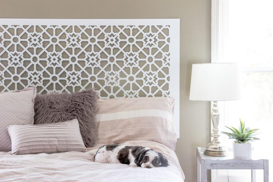 diy headboards with cutout pattern screen behind a bed