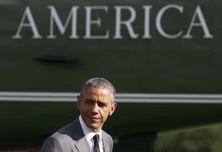 U.S. President Barack Obama walks on the South Lawn of the White House in Washington after visiting the Walter Reed National Military Medical Center, April 29, 2015. REUTERS/Yuri Gripas