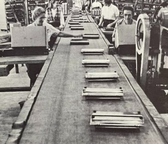 A 1963 promotional booklet shows pieces of a carpet sweeper moving down an assembly line inside the new Bissell factory in Walker. (GRPL Local History Archives)
