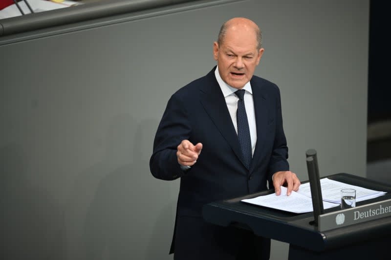 German Chancellor Olaf Scholz makes a government statement on the "current security situation" in a plenary session of the German Bundestag. Sabina Crisan/dpa