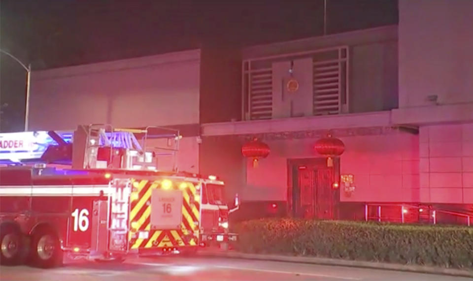 In this image made from video, fire engine is seen outside Chinese consulate in Houston, Tuesday, July 21, 2020. Media reports in Houston said that authorities had responded to reports of a fire at the consulate. Witnesses said that people were burning paper in what appeared to be trash cans, the Houston Chronicle reported, citing police.(KTRK via AP)