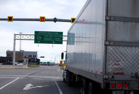 A truck heads towards the United States at the Lacolle border crossing in Lacolle, Quebec, Canada April 26, 2017. REUTERS/Christinne Muschi