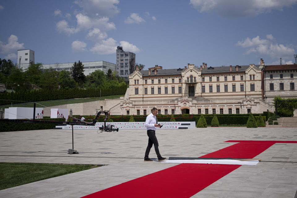 A man walks during preparations at the Castel Mimi in Bulboaca, Moldova, Wednesday, May 31, 2023. Moldova will host the Meeting of the European Political Community on June 1, 2023. Preparations for a major summit of European leaders were still underway in Moldova on Wednesday, a sign of the Eastern European country’s ambitions to draw closer to the West and break with its Russian-dominated past amid the war in neighboring Ukraine. (AP Photo/Andreea Alexandru)