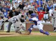 CHICAGO, IL - JUNE 16: David Ortiz #34 of the Boston Red Sox is tagged out at home by Welington Castillo #53 of the Chicago Cubs in the first inning on June 16, 2012 at Wrigley Field in Chicago, Illinois. (Photo by David Banks/Getty Images)