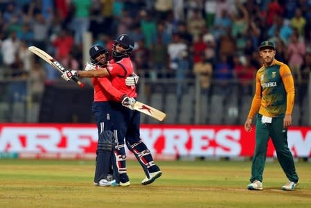 Cricket - South Africa v England - World Twenty20 cricket tournament - Mumbai, India, 18/03/2016. England's Adil Rashid (L) and Moeen Ali celebrate past South Africa's captain Faf du Plessis after winning their match. REUTERS/Danish Siddiqui