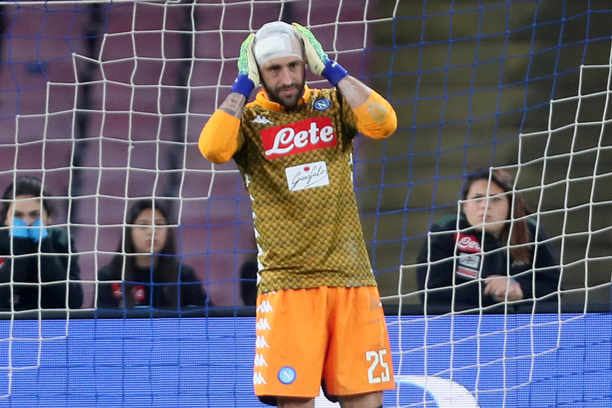 SAN PAOLO STADIUM, NAPLES, CAMPANIA, ITALY - 2019/03/17: Napoli's Colombian goalkeeper David Ospina touch his head after an injury during the Italian Serie A football match SSC Napoli  vs Udinese Calcio at the San Paolo Stadium. SSC Napoli won the match 4-2. (Photo by Pietro Mosca/KONTROLAB /LightRocket via Getty Images)