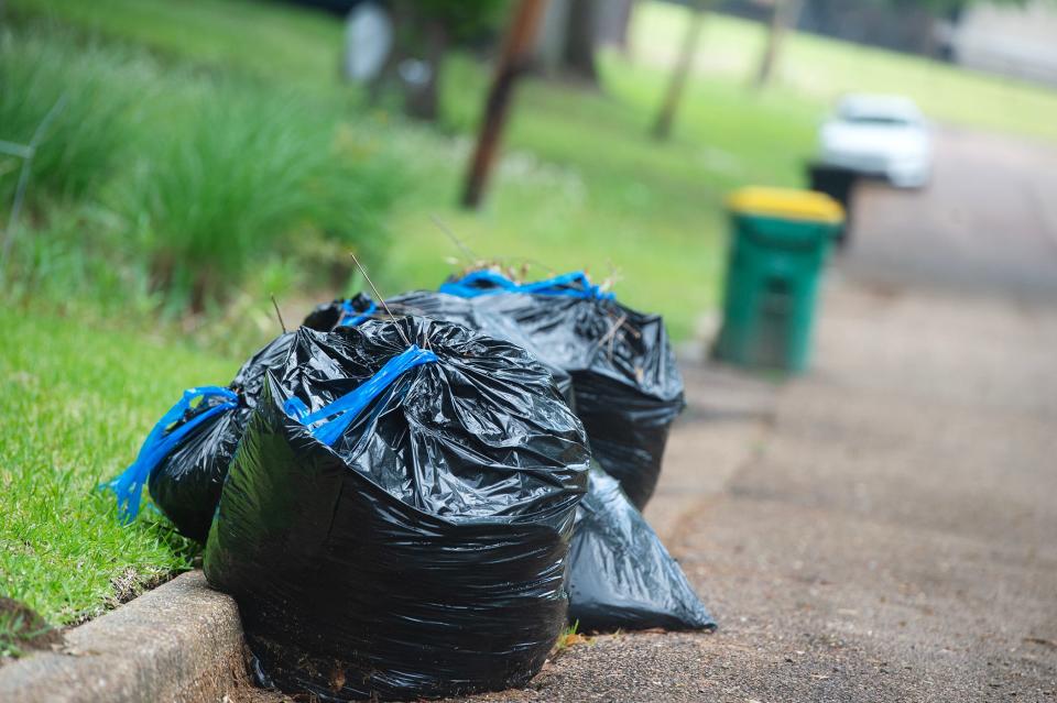 Optimistic Jackson, Miss., residents put out their trash in hopes of it being picked up Monday, April 3, 2023, although the mayor and city council have not come to an agreement on what company to award the contract for trash pickup.