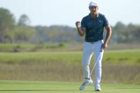 Apr 13, 2018; Hilton Head, SC, USA; Bryson DeChambeau celebrates after putting on the green of the 18th hole during the second round of the RBC Heritage golf tournament at Harbour Town Golf Links. Mandatory Credit: Joshua S. Kelly-USA TODAY Sports