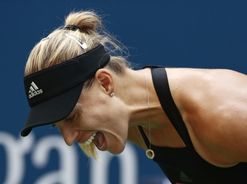 Angelique Kerber, of Germany, reacts against Dominika Cibulkova, of Slovakia, during the third round of the U.S. Open tennis tournament, Saturday, Sept. 1, 2018, in New York. (AP Photo/Andres Kudacki)