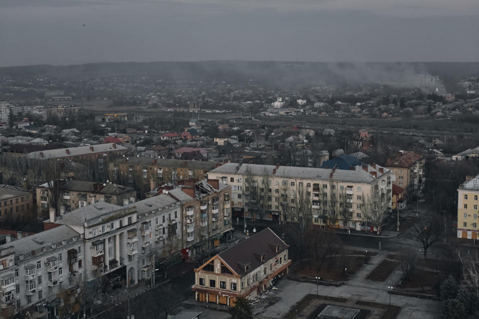 Smoke rises in this aerial view of Bakhmut, the site of the heaviest battles with the Russian troops, in the Donetsk region, Ukraine, Friday, Dec. 9, 2022. (AP Photo/LIBKOS)