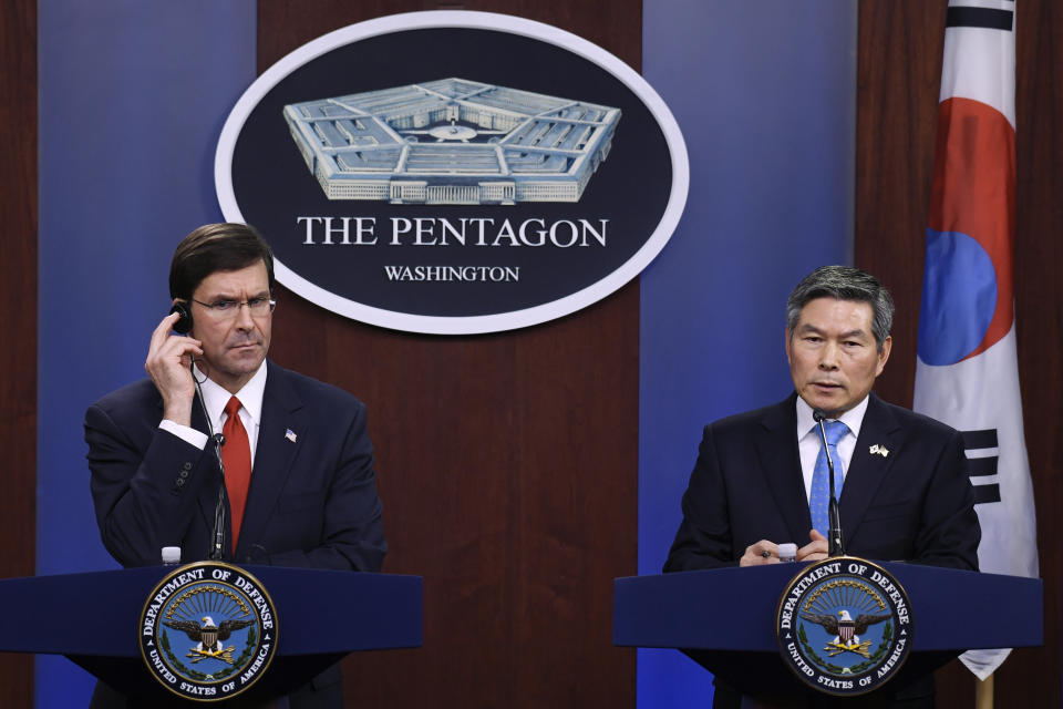 Defense Secretary Mark Esper, left, listens as South Korean National Defense Minister Jeong Kyeong-doo, right, speaks during a news conference at Pentagon in Washington, Monday, Feb. 24, 2020. (AP Photo/Susan Walsh)