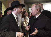 Russian President Vladimir Putin speaks with Russia's chief rabbi Berel Lazar during the World Holocaust Forum marking the 75th anniversary of the liberation of the former Nazi German concentration and extermination camp Auschwitz, at the Yad Vashem Holocaust memorial museum in Jerusalem, Israel, Thursday, Jan. 23, 2020. (Aleksey Nikolskyi, Sputnik Kremlin Pool Photo via AP)