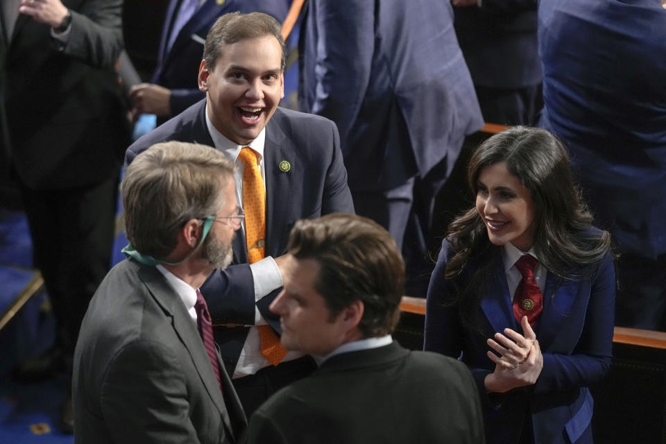 Rep. George Santos, R-N.Y., Rep. Matt Gaetz, R-Fla., and other Republicans gather in the House Chamber before President Joe Biden delivers the State of the Union address to a joint session of Congress at the U.S. Capitol, Tuesday, Feb. 7, 2023, in Washington. (AP Photo/Patrick Semansky)