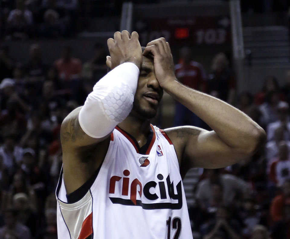 Portland Trail Blazers forward LaMarcus Aldridge reacts after missing a basket on a fast break during the second half of Game 3 of an NBA basketball first-round playoff series against the Houston Rockets in Portland, Ore., Friday, April 25, 2014. Houston won 121-116.(AP Photo/Don Ryan)