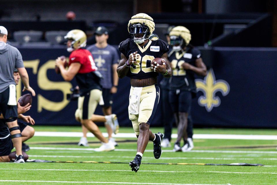 Aug 11, 2023; Metairie, LA, USA;  New Orleans Saints running back Jamaal Williams (30) works on offensive drills during training camp at the Caesars Superdome.