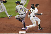 Milwaukee Brewers first baseman Keston Hiura (18) pulls his foot off the bag after getting the out on Pittsburgh Pirates' Kevin Newman (27) during the second inning of a baseball game in Pittsburgh, Friday, July 2, 2021. (AP Photo/Gene J. Puskar)