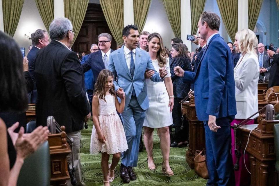 Assembly Speaker Robert Rivas, D-Salinas, on Friday is accompanied by his wife, Christen, and daughter, Melina, during his swearing-in ceremony on the Assembly floor of the state Capitol in Sacramento.