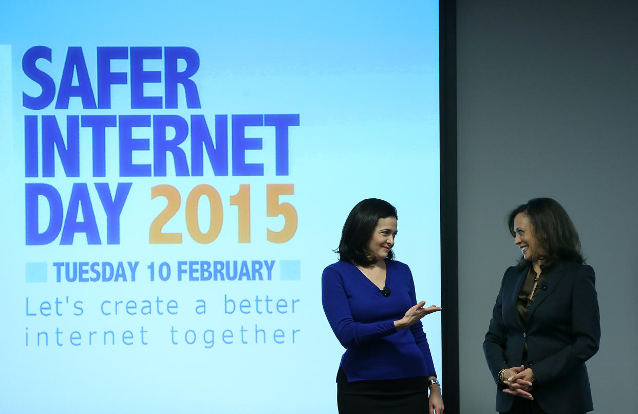 MENLO PARK, CA - FEBRUARY 10:  Facebook COO Sheryl Sandberg (L) gestures towards California Attorney General Kamala Harris (R) during a Safer Internet Day event at Facebook headquarters on February 10, 2015 in Menlo Park, California. Harris delivered the keynote speech at the event, designed to promote safe, effective use of the internet and mobile technology. Safer Internet Day is celebrated annually in more than 100 countries on the the second Tuesday in February.  (Photo by Justin Sullivan/Getty Images)