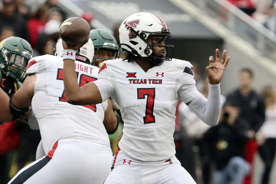 Texas Tech quarterback Donovan Smith throws downfield against Baylor in the first half of an NCAA college football game, Saturday, Nov. 27, 2021, in Waco, Texas. (Rod Aydelotte/Waco Tribune-Herald via AP)