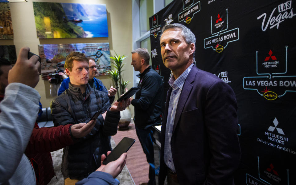 Washington head coach Chris Petersen speaks with reporters ahead of the Las Vegas Bowl NCAA college football game in Las Vegas, Tuesday, Dec. 17, 2019. (Chase Stevens/Las Vegas Review-Journal via AP)