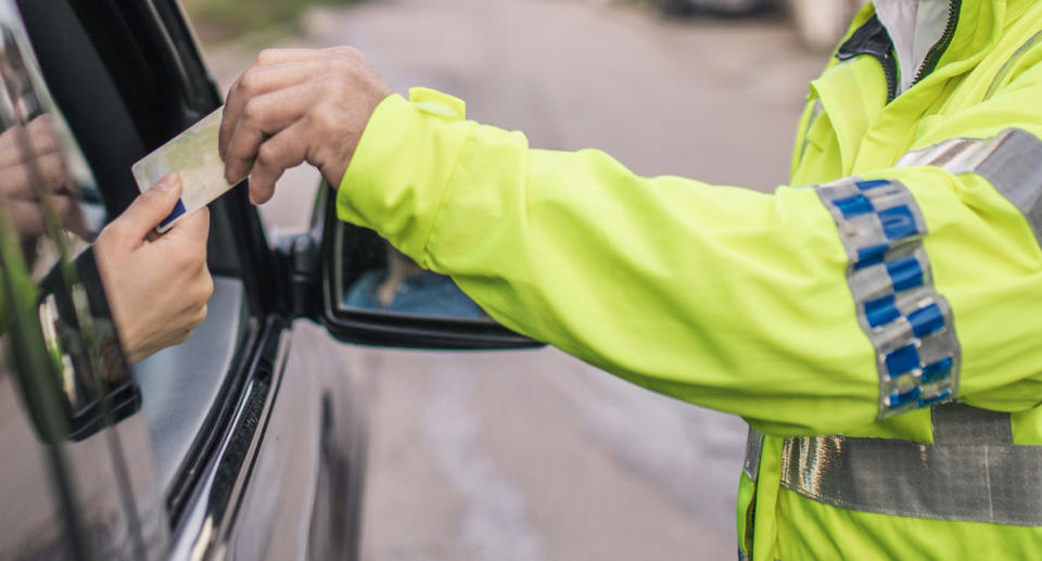 A driver is pulled over by police.