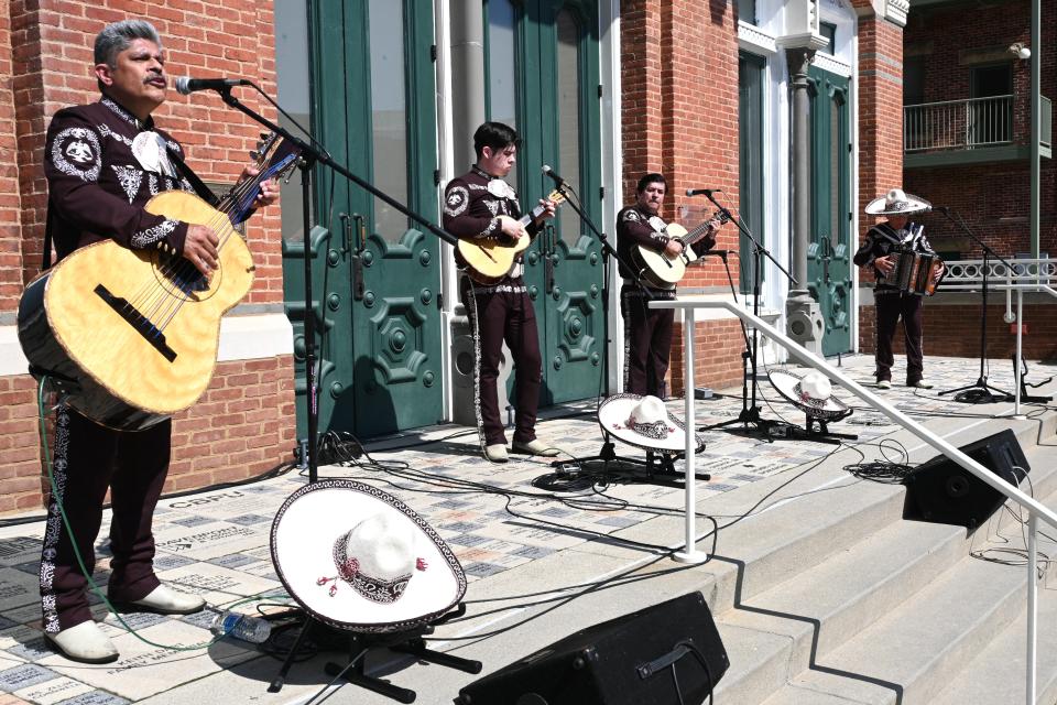 A mariachi band performed on the steps of Tibbits Opera House.