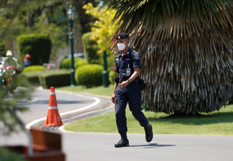 Security guard wears protective mask due to COVID-19 outbreak at Government House in Bangkok