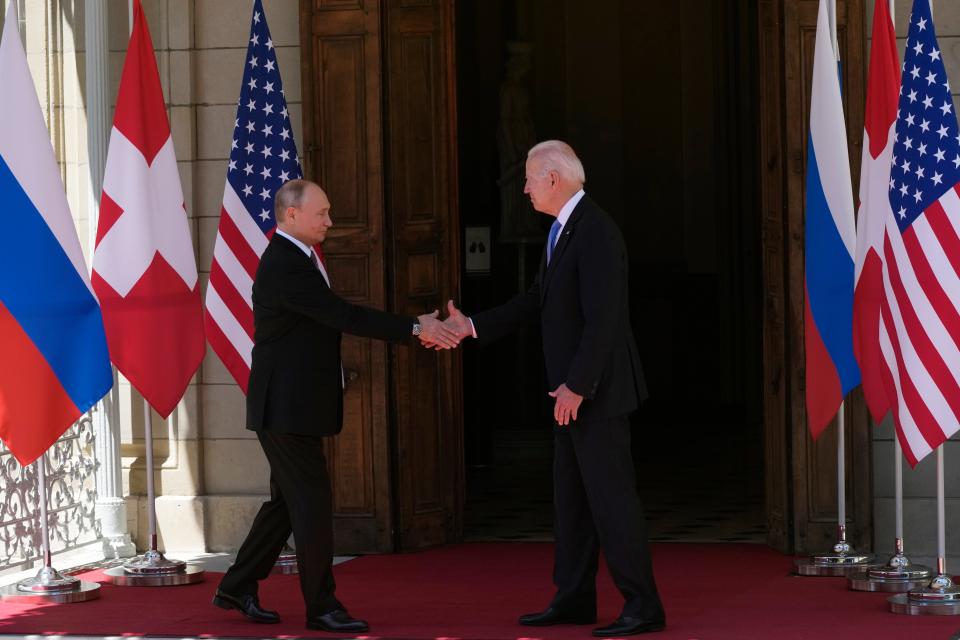 Russian President Vladimir Putin, left, and U.S President Joe Biden shake hands during their meeting at the ‘Villa la Grange’ in Geneva on June 16 (AP)