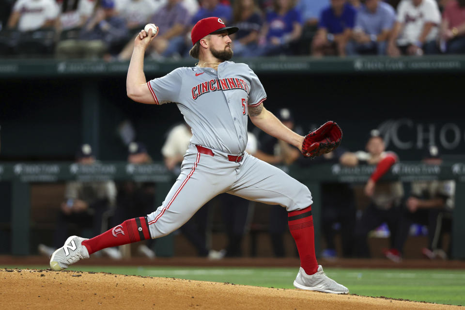 Cincinnati Reds pitcher Graham Ashcraft (51) delivers against the Texas Rangers during the first inning of a baseball game Friday, April 26, 2024, in Arlington, Texas. (AP Photo/Richard W. Rodriguez)