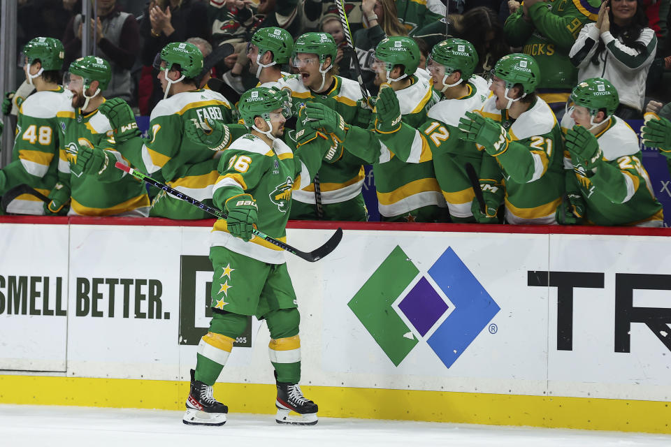 Minnesota Wild right wing Mats Zuccarello (36) is congratulated for his goal during the shootout against the Vancouver Canucks in an NHL hockey game Saturday, Dec. 16, 2023, in St Paul, Minn. (AP Photo/Matt Krohn)