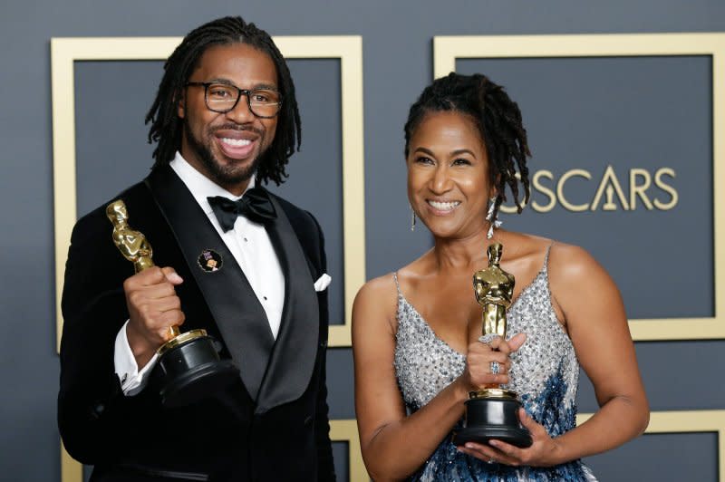 Matthew A. Cherry and executive producer Karen Rupert Toliver hold the Oscars they won for "Hair Love." File Photo by John Angelillo/UPI