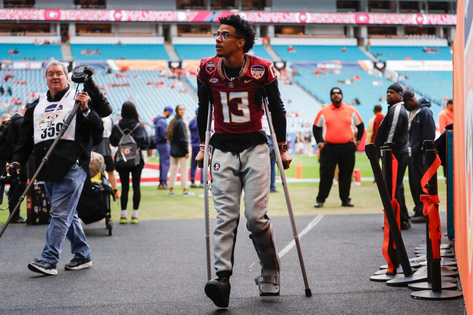 Dec 30, 2023; Miami Gardens, FL, USA; Florida State Seminoles quarterback Jordan Travis (13) looks on prior to the game against the Georgia Bulldogs in the 2023 Orange Bowl at Hard Rock Stadium. Mandatory Credit: Sam Navarro-USA TODAY Sports