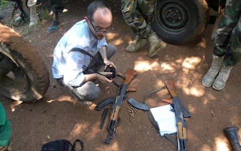 Representatives from Conflict Armament Research working in the field