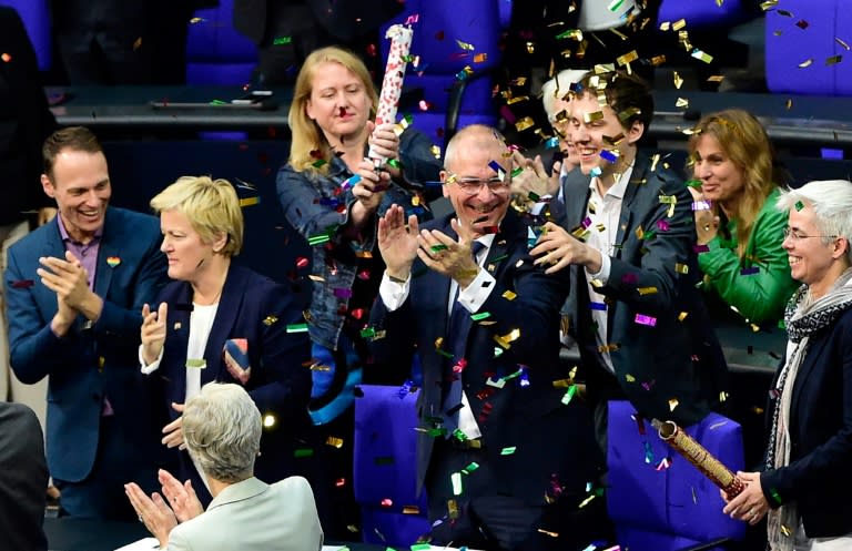 German Green MPs stand in a rain of confetti rain after the vote to legalise gay marriage